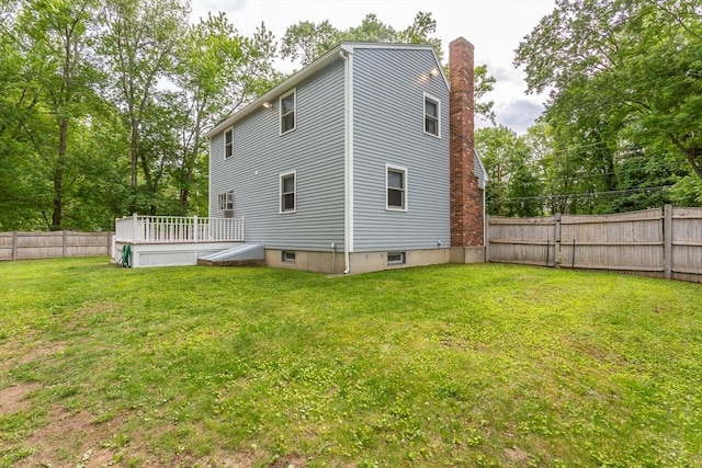 145 Reservoir St, Norton, MA 02766 - back of property with a deck and a chimney
