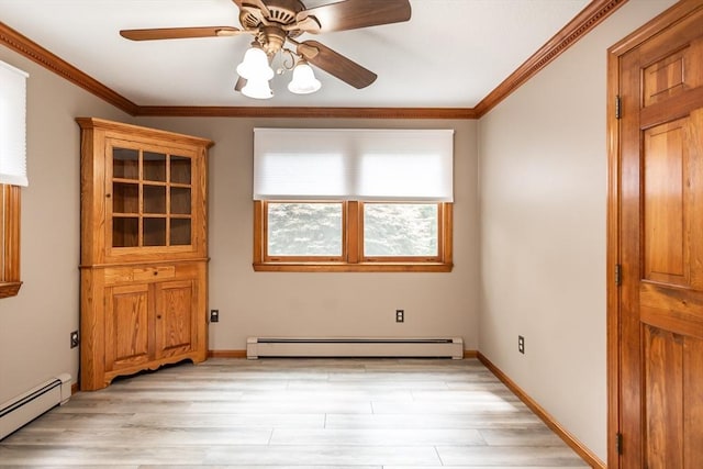 145 Reservoir St, Norton, MA 02766 - spare room featuring a baseboard heating unit, ceiling fan, light wood-style flooring, ornamental molding, and baseboards