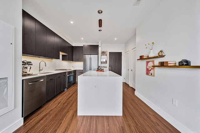 99 Sumner Unit 514, Boston, MA 02128 - kitchen featuring appliances with stainless steel finishes, a sink, dark wood-style floors, light countertops, and recessed lighting