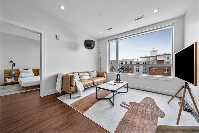 99 Sumner Unit 514, Boston, MA 02128 - living room featuring wood finished floors and baseboards