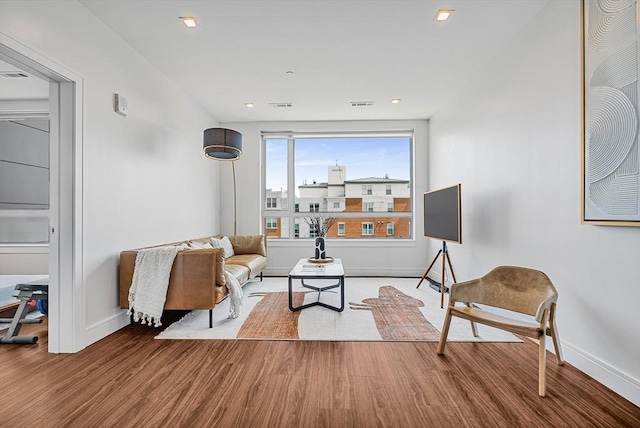99 Sumner Unit 514, Boston, MA 02128 - living area with wood finished floors, baseboards, and recessed lighting