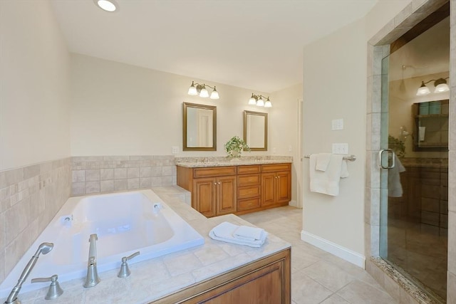 full bath with a bath, double vanity, a stall shower, and tile patterned flooring