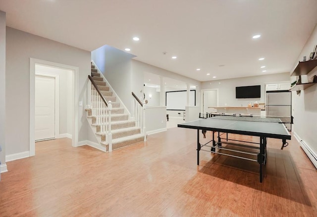 rec room featuring baseboards, light wood-style floors, and recessed lighting