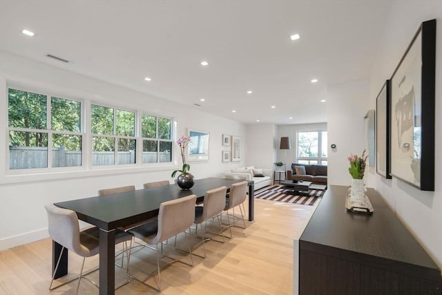 dining area featuring visible vents, light wood-style flooring, and recessed lighting