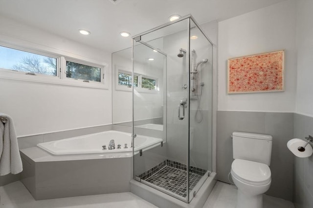 bathroom featuring recessed lighting, a shower stall, toilet, and a bath