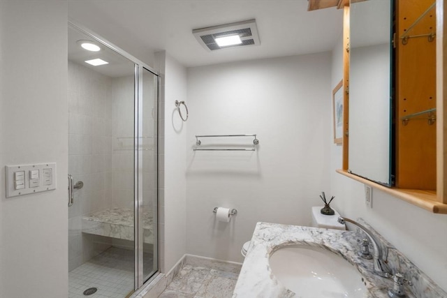 full bathroom with visible vents, toilet, a stall shower, vanity, and baseboards