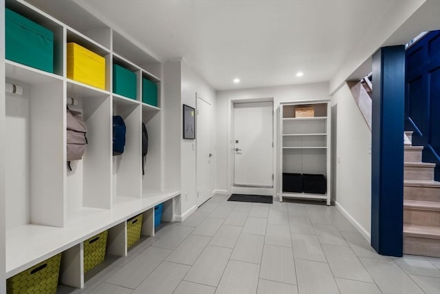 mudroom featuring recessed lighting and baseboards