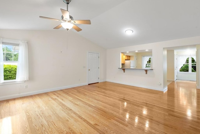 22 Pomeroy Meadow Rd Unit 4, Southampton, MA 01073 - unfurnished living room with vaulted ceiling, light wood-type flooring, and ceiling fan