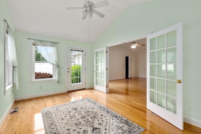 22 Pomeroy Meadow Rd Unit 4, Southampton, MA 01073 - spare room featuring a ceiling fan, vaulted ceiling, light wood finished floors, and french doors