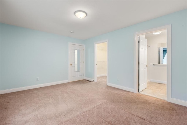 22 Pomeroy Meadow Rd Unit 4, Southampton, MA 01073 - unfurnished bedroom featuring carpet floors, a spacious closet, a closet, and connected bathroom