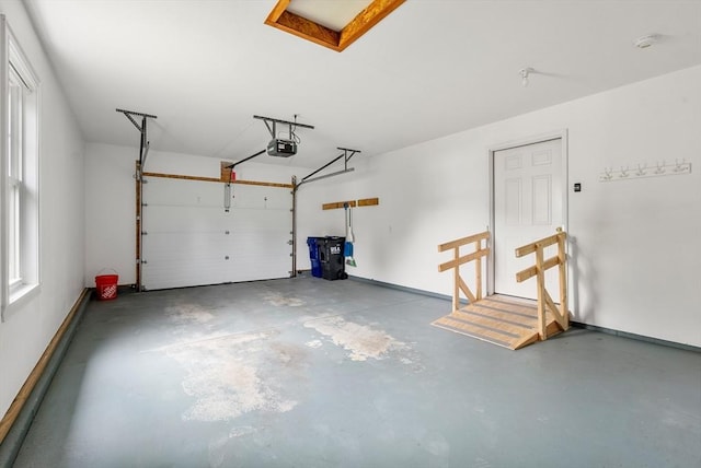 22 Pomeroy Meadow Rd Unit 4, Southampton, MA 01073 - garage with a garage door opener and baseboards