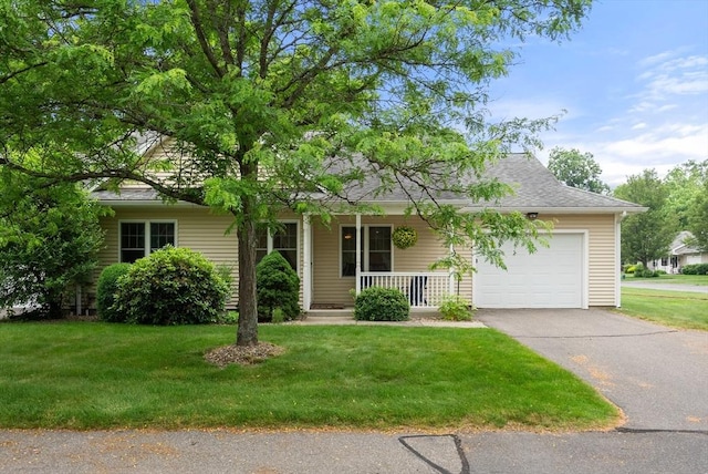 22 Pomeroy Meadow Rd Unit 4, Southampton, MA 01073 - view of front facade featuring a garage, covered porch, driveway, and a front yard