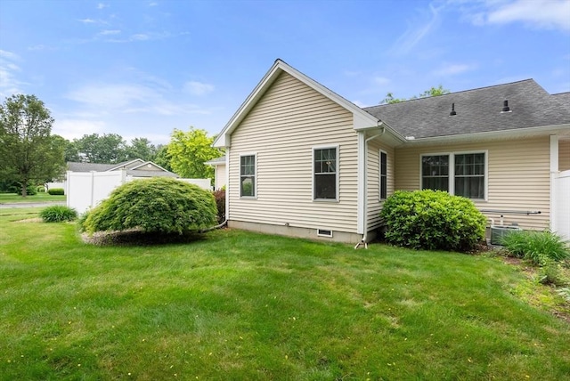 22 Pomeroy Meadow Rd Unit 4, Southampton, MA 01073 - rear view of house with a lawn and a shingled roof
