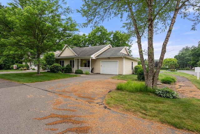 22 Pomeroy Meadow Rd Unit 4, Southampton, MA 01073 - ranch-style home with an attached garage, asphalt driveway, and a front yard