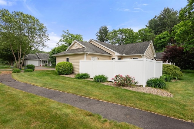22 Pomeroy Meadow Rd Unit 4, Southampton, MA 01073 - view of side of home with a garage and roof with shingles
