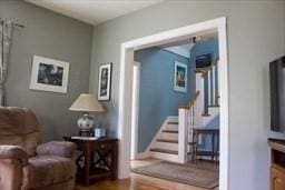 374 Swains Pond Ave, Melrose, MA 02176 - sitting room featuring stairway and wood finished floors