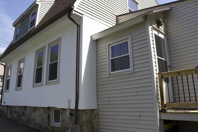 374 Swains Pond Ave, Melrose, MA 02176 - view of property exterior featuring stucco siding