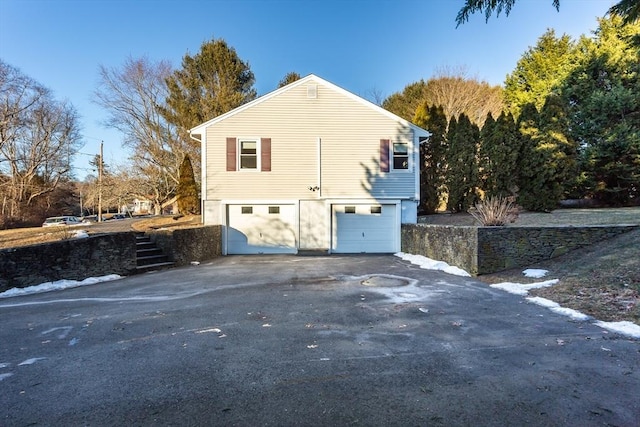 view of side of property with a garage