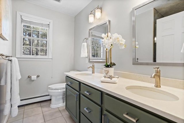 full bathroom with baseboard heating, tile patterned flooring, a sink, and toilet