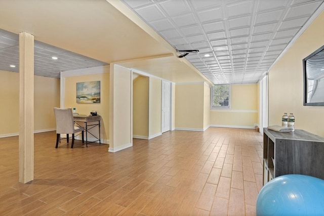 interior space with light wood-style floors, recessed lighting, and baseboards