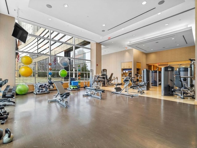 500 Atlantic Ave Unit 16R, Boston, MA 02210 - gym featuring a high ceiling, a wall of windows, recessed lighting, and wood finished floors