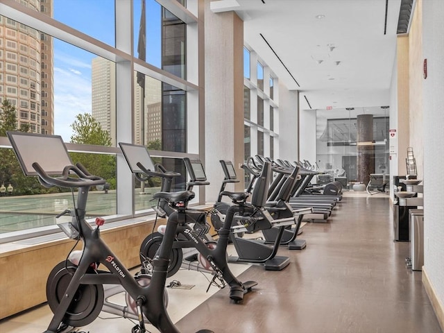 500 Atlantic Ave Unit 16R, Boston, MA 02210 - exercise room featuring a city view and a towering ceiling