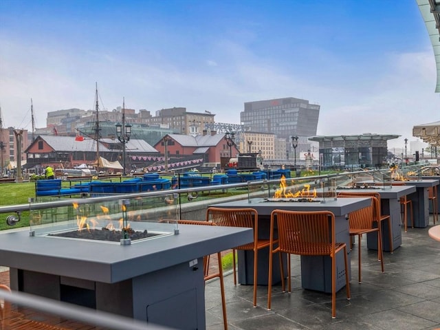 500 Atlantic Ave Unit 16R, Boston, MA 02210 - view of patio / terrace featuring an outdoor fire pit and a view of city