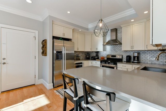 37 P St Unit 5, Boston, MA 02127 - kitchen with wall chimney exhaust hood, appliances with stainless steel finishes, a sink, ornamental molding, and recessed lighting