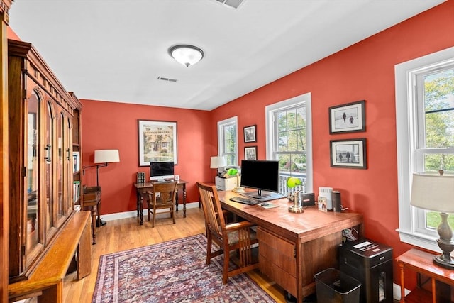 office area featuring light wood-style floors and baseboards