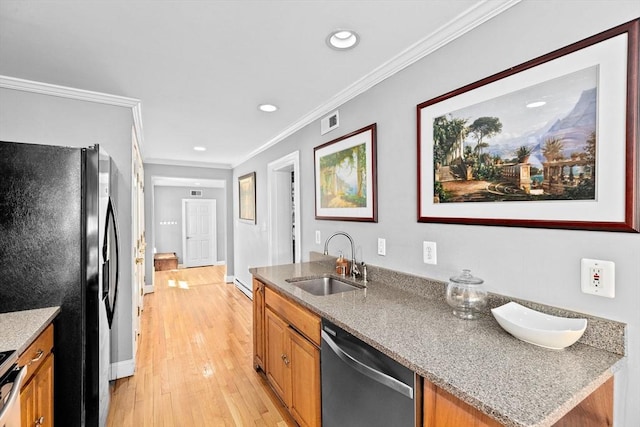 kitchen featuring crown molding, brown cabinetry, visible vents, a sink, and stainless steel appliances