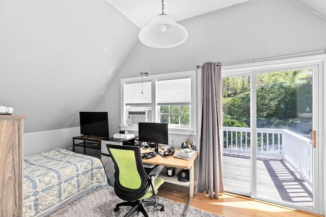 office area with vaulted ceiling and wood finished floors