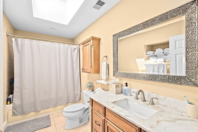 full bath with shower / bath combo, vanity, toilet, tile patterned floors, and a skylight