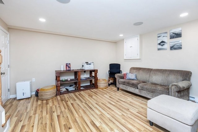 living area with recessed lighting and light wood-type flooring