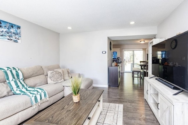 living room with baseboards, recessed lighting, and wood finished floors