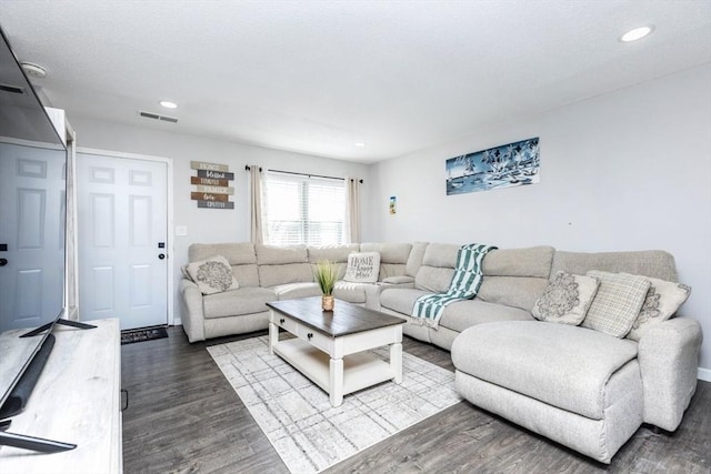 living room featuring recessed lighting, visible vents, and wood finished floors