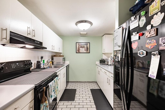 96 Old Colony Ave Unit 153, Taunton, MA 02718 - kitchen with black appliances, under cabinet range hood, tasteful backsplash, light countertops, and white cabinets