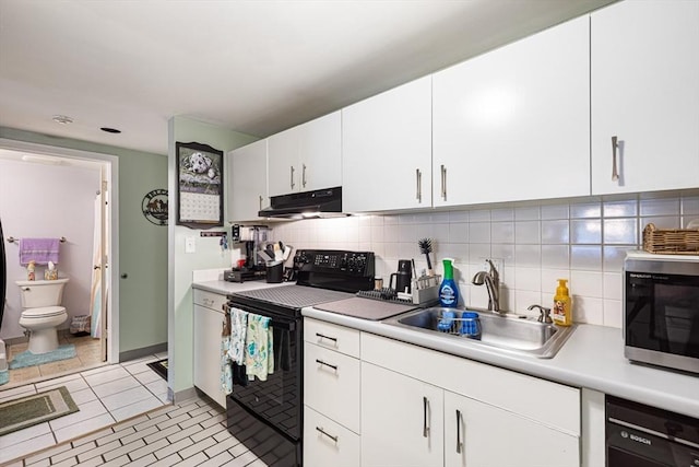 96 Old Colony Ave Unit 153, Taunton, MA 02718 - kitchen with black appliances, under cabinet range hood, light countertops, tasteful backsplash, and white cabinets