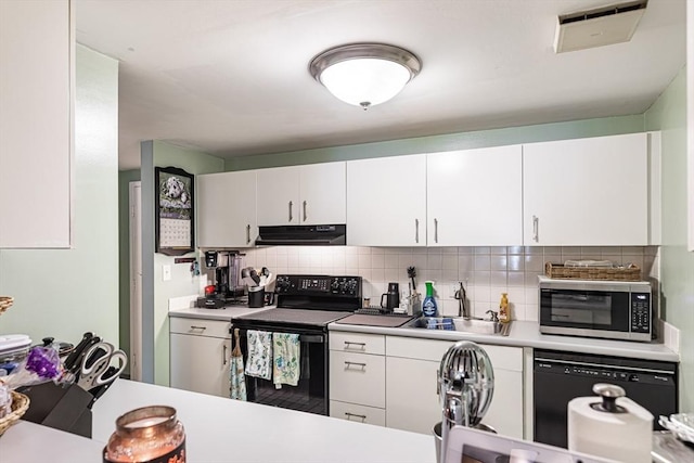 96 Old Colony Ave Unit 153, Taunton, MA 02718 - kitchen with black appliances, under cabinet range hood, backsplash, and light countertops