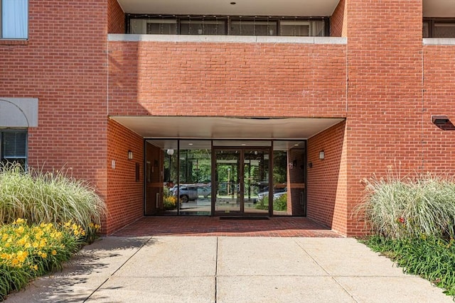 96 Old Colony Ave Unit 153, Taunton, MA 02718 - property entrance with brick siding and french doors