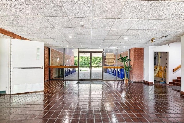 96 Old Colony Ave Unit 153, Taunton, MA 02718 - lobby with a paneled ceiling, recessed lighting, a wall of windows, stairway, and a security system