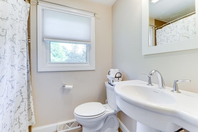 49 Hopkins Dr, Whitman, MA 02382 - bathroom featuring toilet, a sink, baseboards, and curtained shower