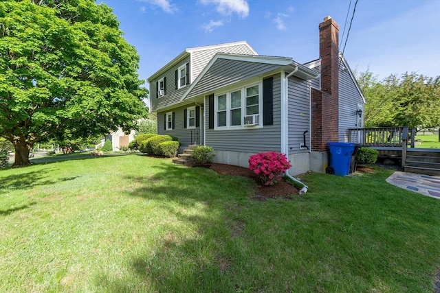49 Hopkins Dr, Whitman, MA 02382 - view of property exterior featuring a chimney, a deck, and a yard
