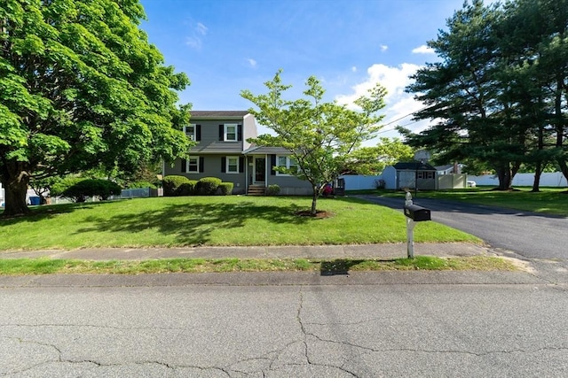 49 Hopkins Dr, Whitman, MA 02382 - view of front of home featuring a front yard, a storage unit, and entry steps