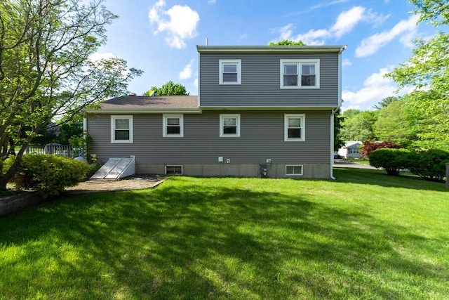 49 Hopkins Dr, Whitman, MA 02382 - rear view of house with a lawn