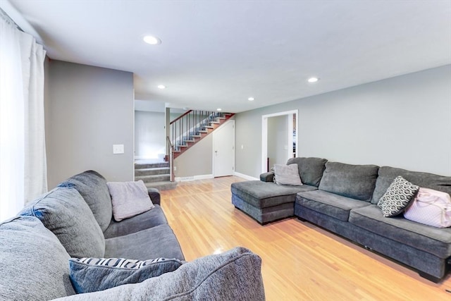 49 Hopkins Dr, Whitman, MA 02382 - living area featuring stairway, wood finished floors, recessed lighting, and baseboards