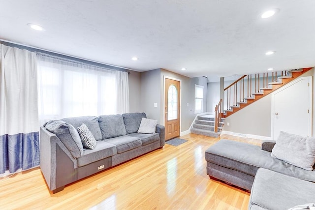 49 Hopkins Dr, Whitman, MA 02382 - living area featuring stairway, baseboards, light wood finished floors, and recessed lighting