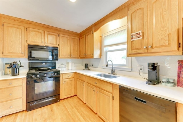 49 Hopkins Dr, Whitman, MA 02382 - kitchen featuring black appliances, a sink, light brown cabinetry, and light countertops