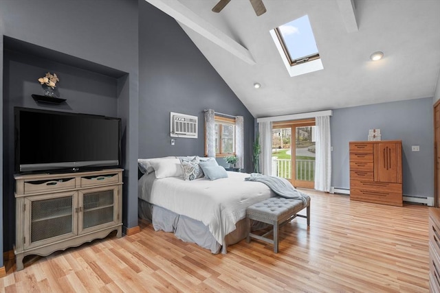 bedroom featuring baseboard heating, light wood finished floors, high vaulted ceiling, a skylight, and access to exterior