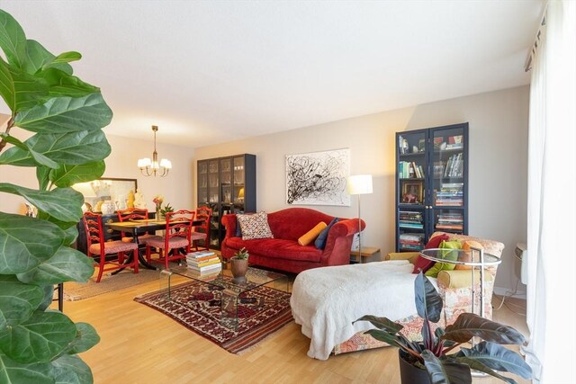 800 Bearses Way Unit 5Ec, Barnstable, MA 02601 - living room featuring a chandelier and wood finished floors