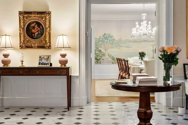 interior space featuring an inviting chandelier, light tile flooring, and ornamental molding